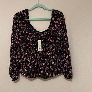 Franchesca’s black shirt with pink flower print.